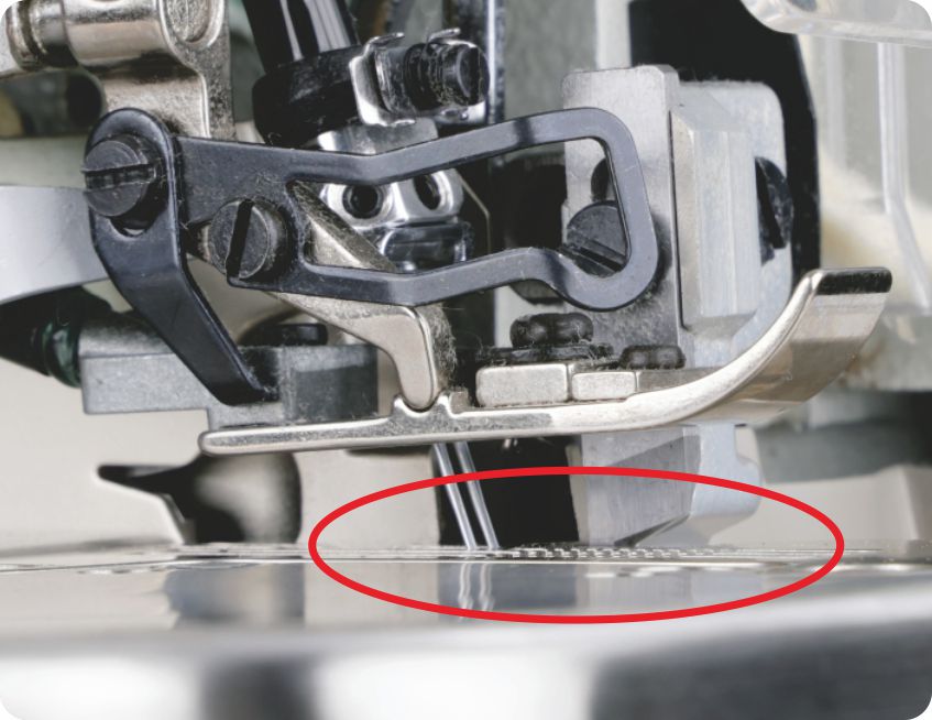 Lowered feed teeth when placing fabric prevents layer misalignment